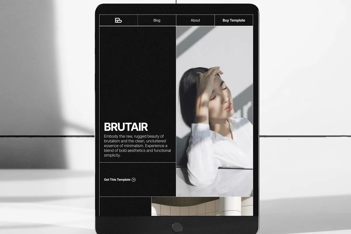 Brutair in dark mode on a tablet standing in a white room: BRUTAIR in heavy type beside a photograph, the navigation as a row of cells.